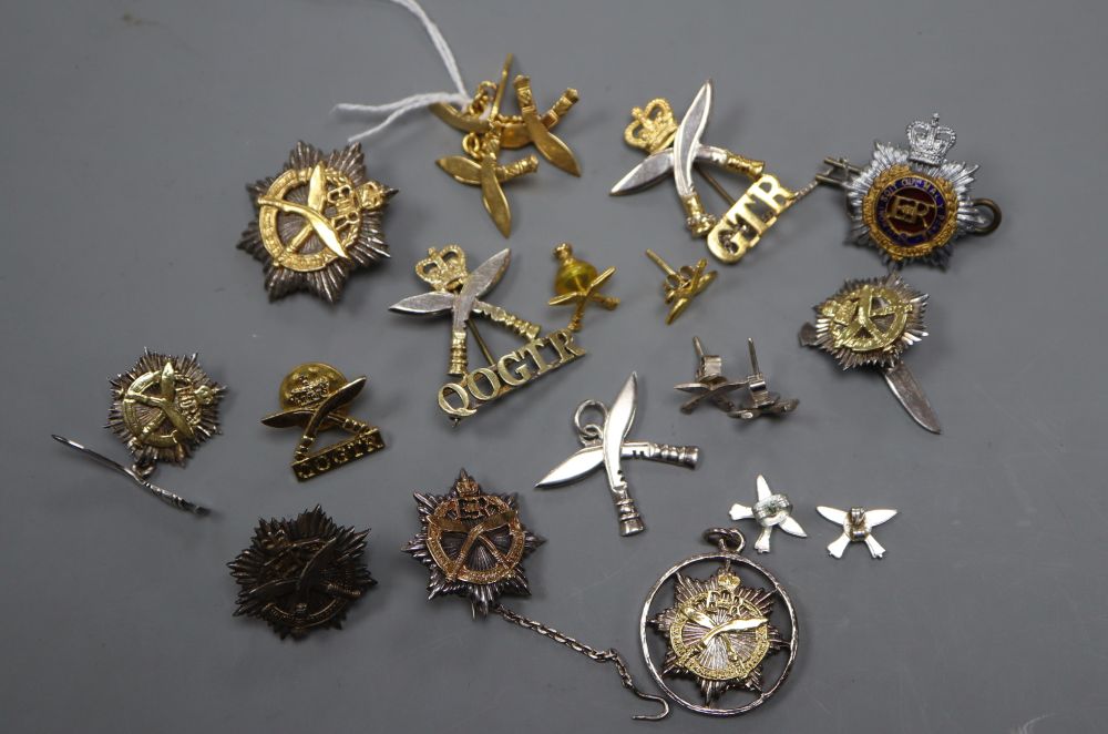 A pair of Chinese yellow metal (stamped 22k) Gurkha regiment? cufflinks, 6.4 grams and a group of assorted Gurkha related badges etc.